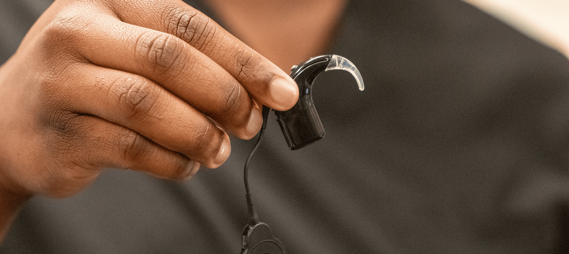 A man holds the Cochlear Nucleus Nexa, a “smart” Cochlear implant featuring on-board memory and upgradeable firmware