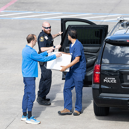 Elevidys medication transport A UTMB Police officer dropping off the gene infusion medication at UTMB Health Bay Colony Pediatrics Specialty Center
