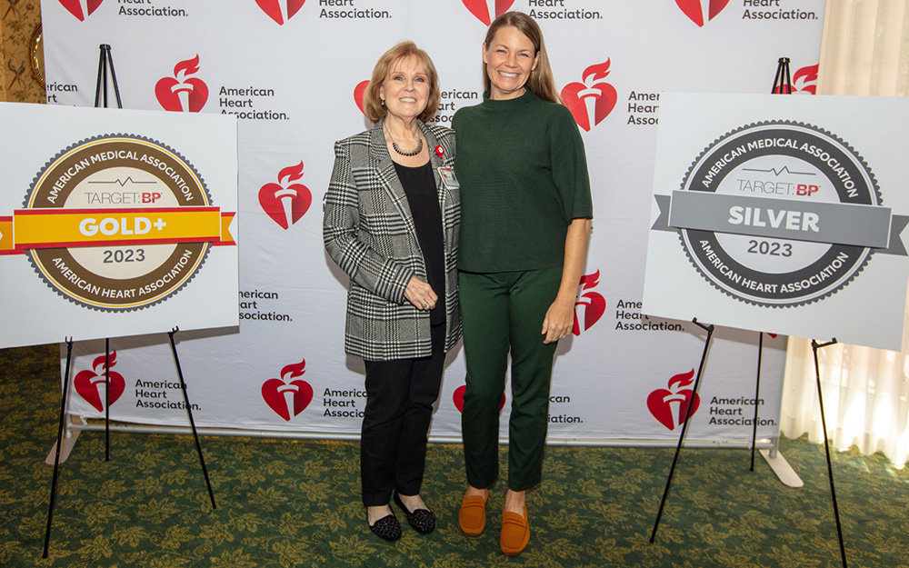Dr. Carolyn Risinger and Dr. Angela Raimer stand with the Target BP awards