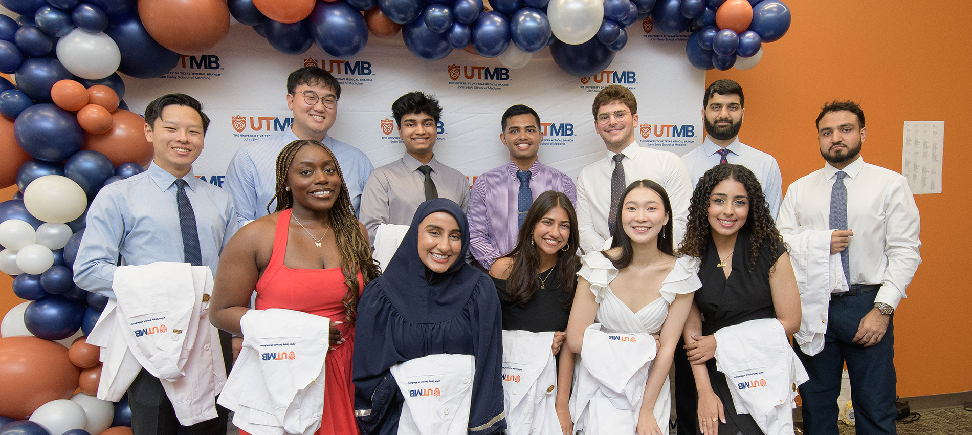 New medical students celebrate a milestone moment during the John Sealy School of Medicine White Coat Ceremony, where they received the symbolic white coat representing compassion, professionalism, and service.