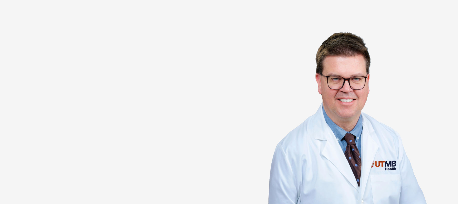 Max Wintermark appears in a white coat with an orange and blue UTMB logo.