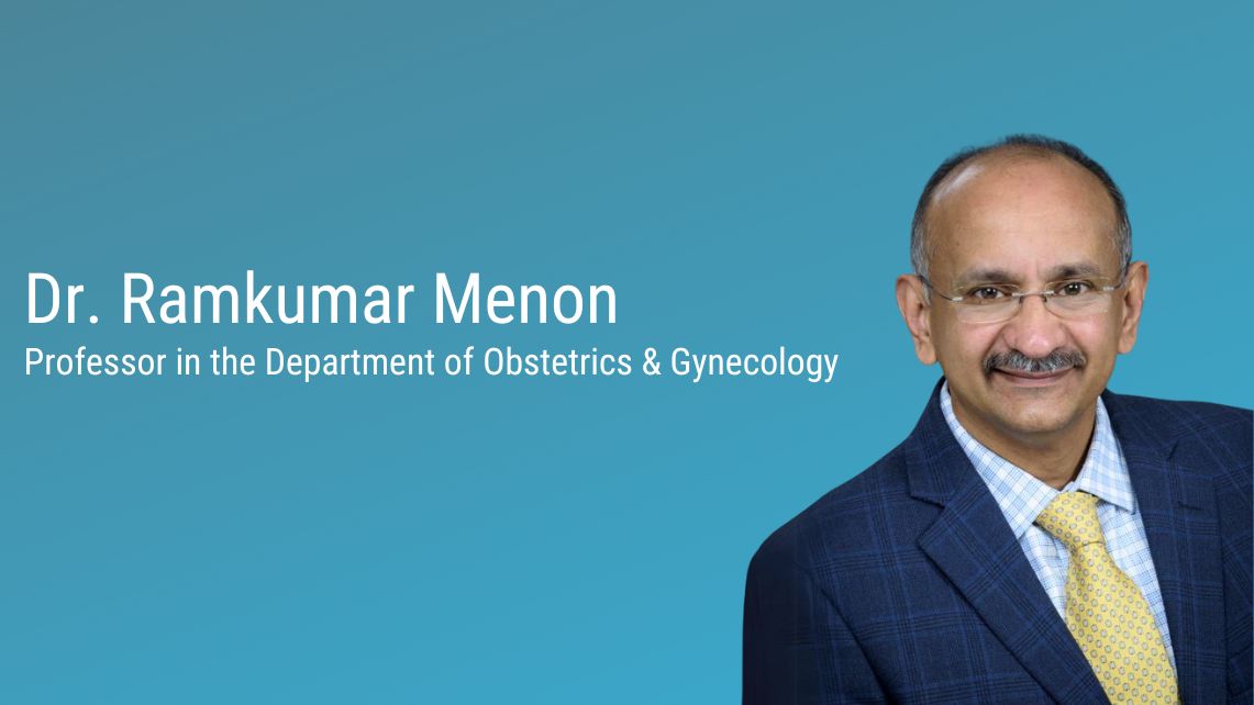 A person in a suit stands against a blue background beside text displaying the name and academic title “Dr. Ramkumar Menon, Professor in the Department of Obstetrics & Gynecology.”