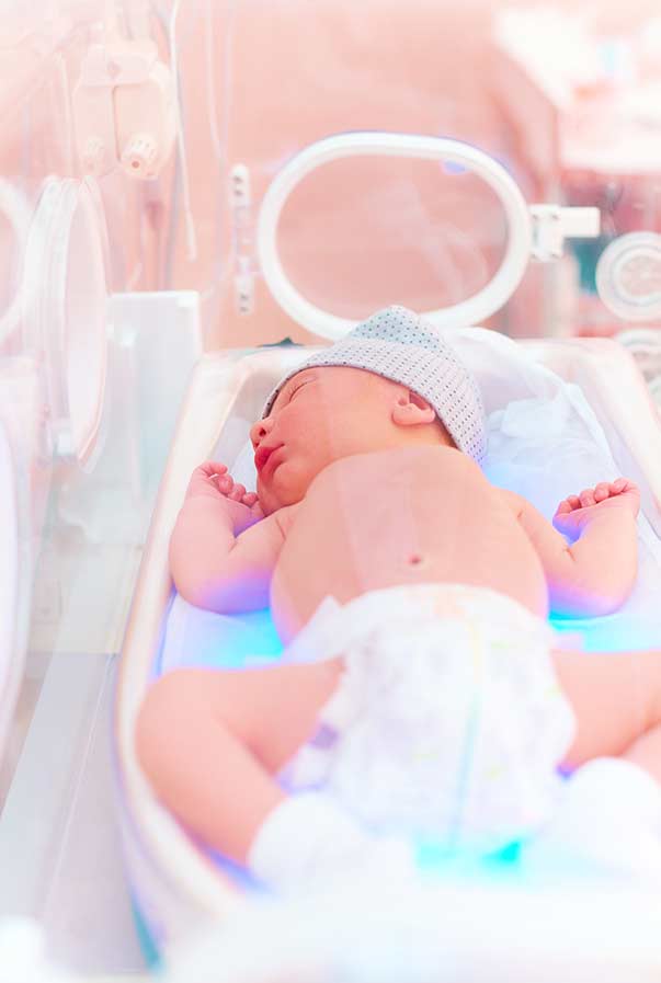 Sleeping infant in the neonatal intensive care unit.