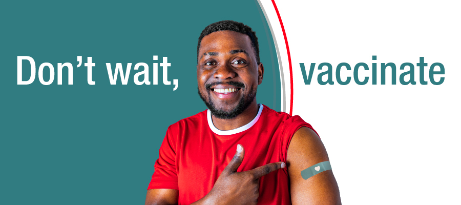 A graphic shows a person pointing to a bandage on the upper arm against a teal background, with large white text reading “Don’t wait, vaccinate,” emphasizing vaccination as a public health message