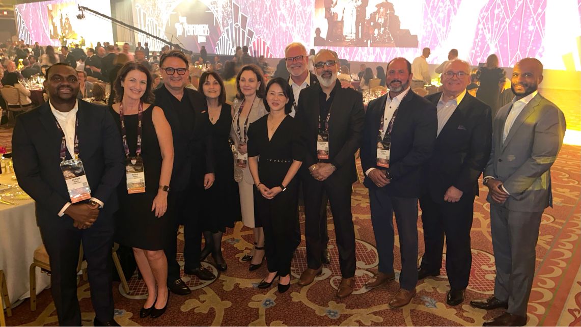 Group of UTMB Health leaders and staff wearing formal attire stand together at an awards event, celebrating recognition as a top performer in Vizient’s 2025 Bernard A. Birnbaum Quality and Accountability Awards for Pediatric Hospital Services