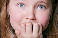 Girl biting nails. From PhotoSpin/ Matt Antonino