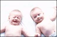 twins, one crying